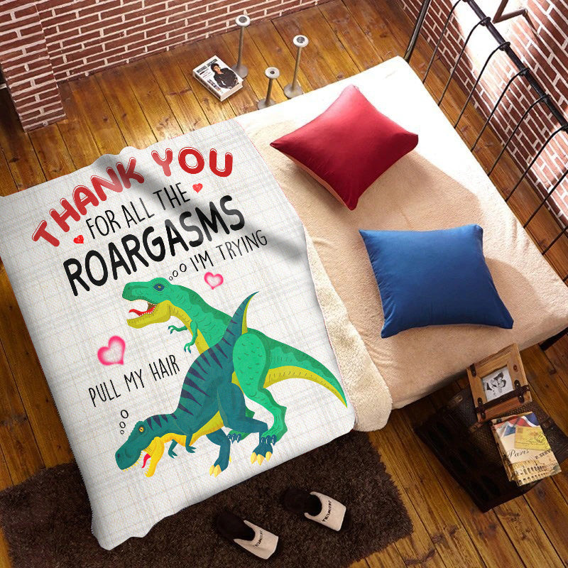 Woman holding a T Rex Blanket outside