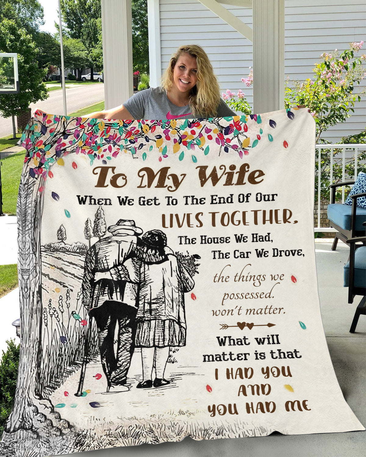 Woman holding a To My Wife Blanket with couple